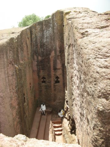 lalibellaschurchesarecutoutoftherockfromabovetheyremainattachedtothestoneonlyontheground.jpg