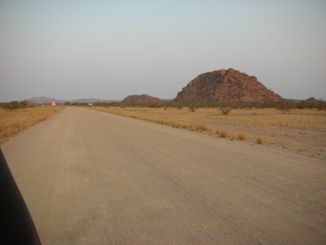 theareaaroundtwyfelfonteinindamaralandnorthernnamibiahasmanypicturesquepilesofrocks.jpg